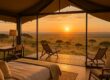 Luxury tent overlooking Maasai Mara plains at sunrise
