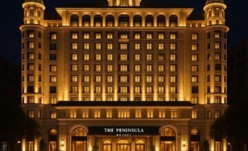 The Peninsula Beijing lit up at night, showcasing luxury and cinematic architecture
